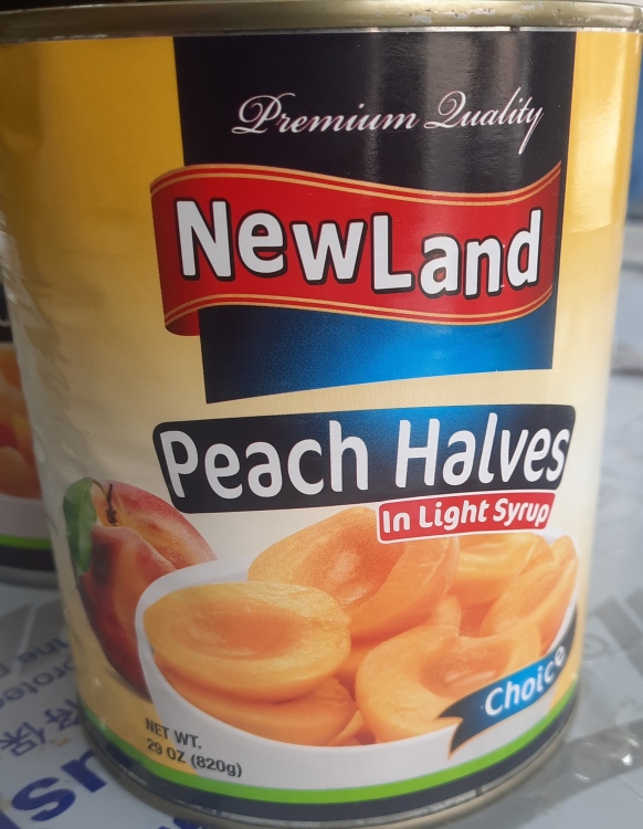 انصاف دراق بالشراب الخفيف نيولاند 820 غرام 